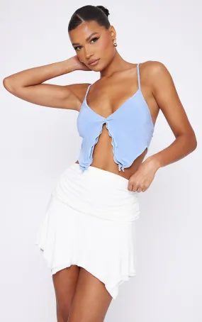 Crop top moulant bleu ciel fendu à volants